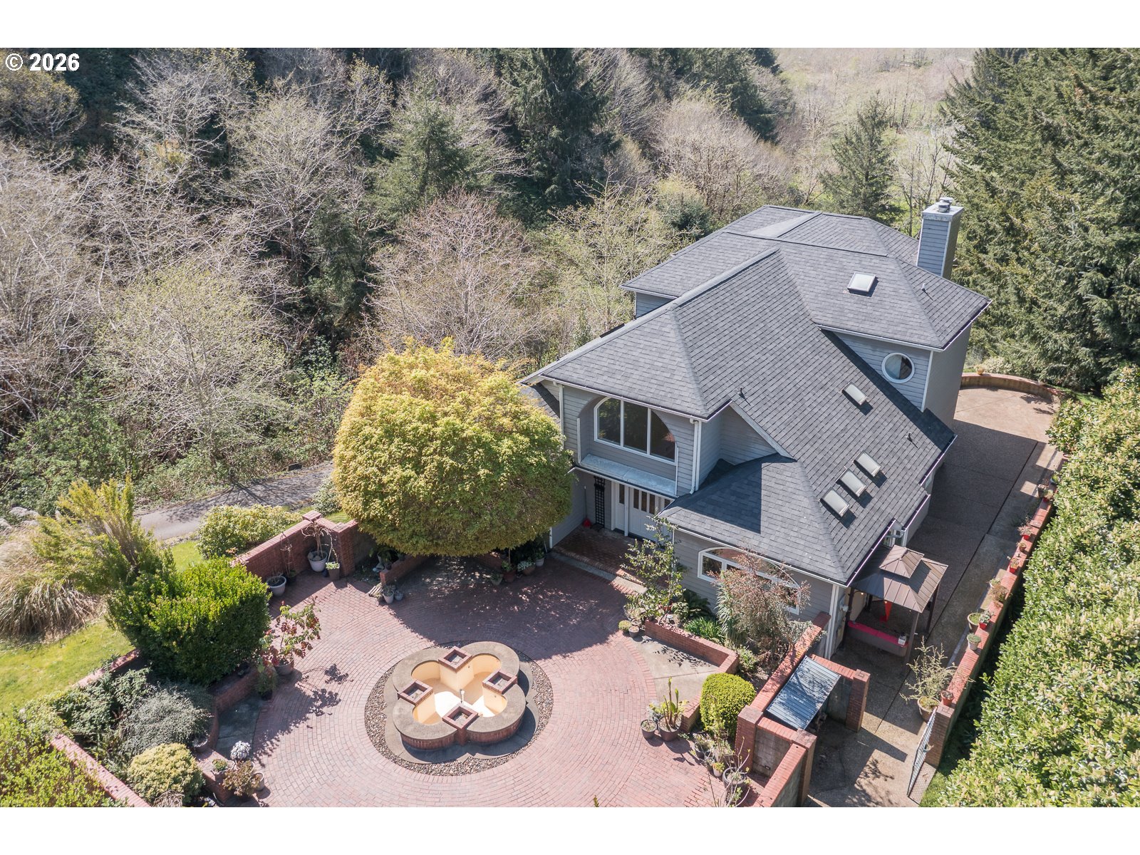 an aerial view of a house with yard swimming pool and outdoor seating