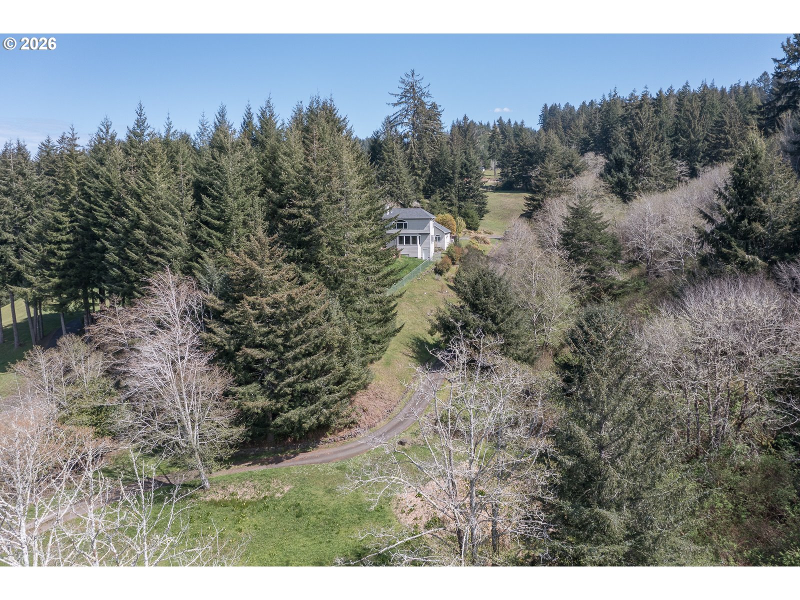 626 North Bayview Loop Waldport, OR 97394 - Photo 34 of 38 a view of a city with lush green forest