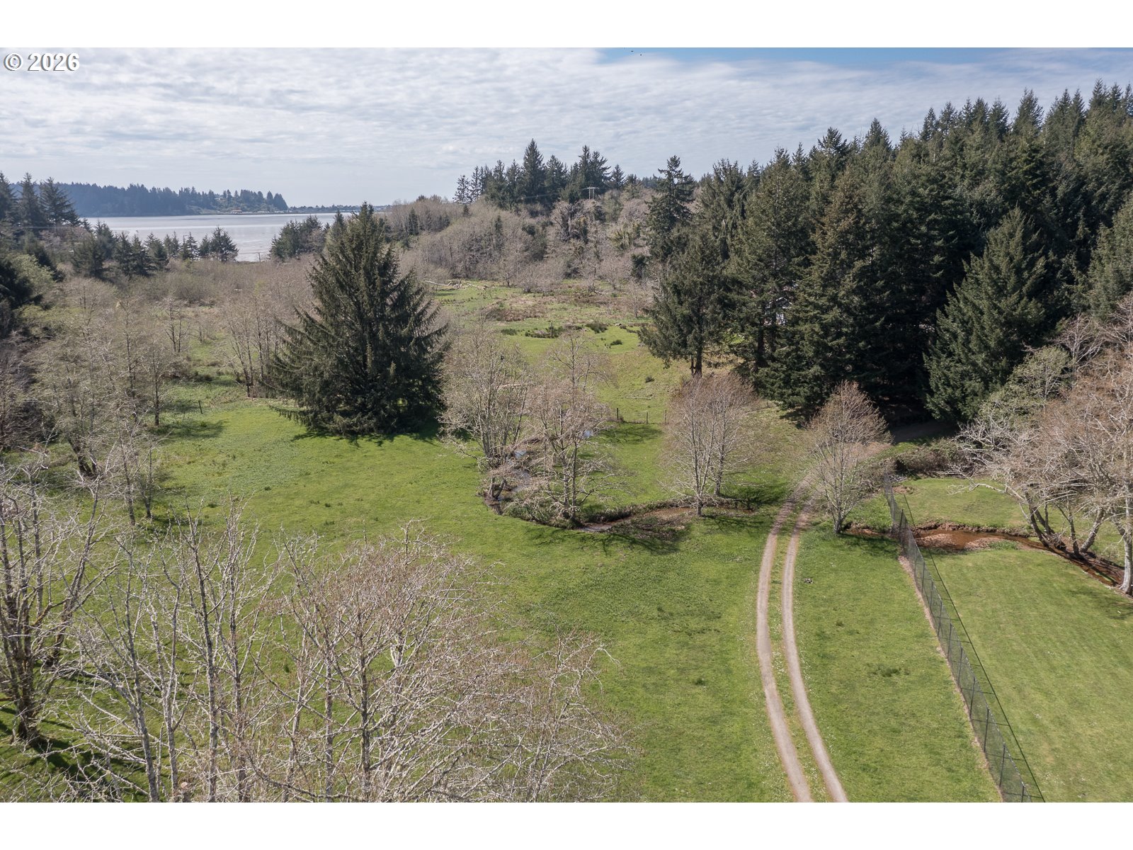 626 North Bayview Loop Waldport, OR 97394 - Photo 35 of 38 a view of a big yard with a mountain