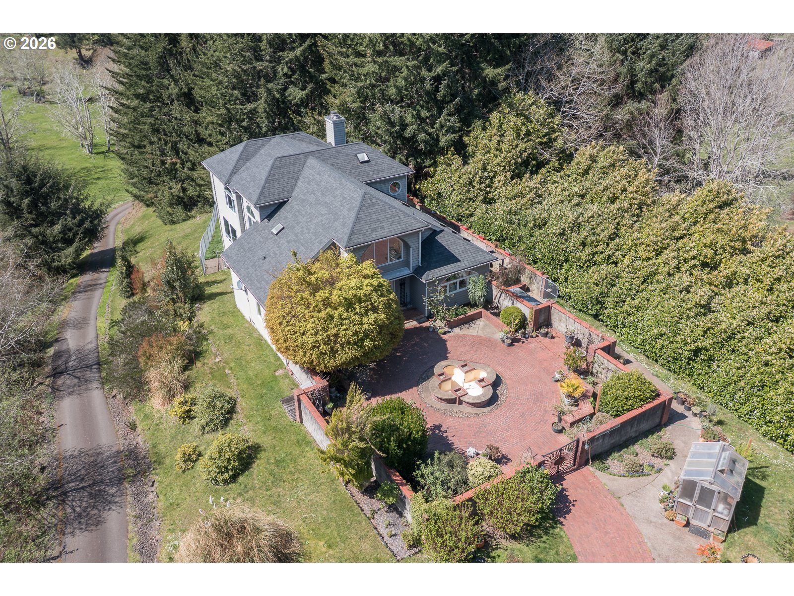 626 North Bayview Loop Waldport, OR 97394 - Photo 38 of 38 an aerial view of a house with a yard and trees