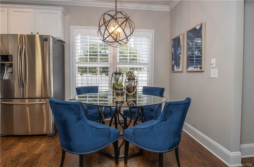 728 Shady Grove Crossing Fort Mill, SC 29708 - Photo 13 of 41 a view of a dining room with furniture window and wooden floor