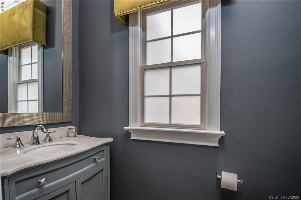 728 Shady Grove Crossing Fort Mill, SC 29708 - Photo 14 of 41 a bathroom with a sink a vanity and a window