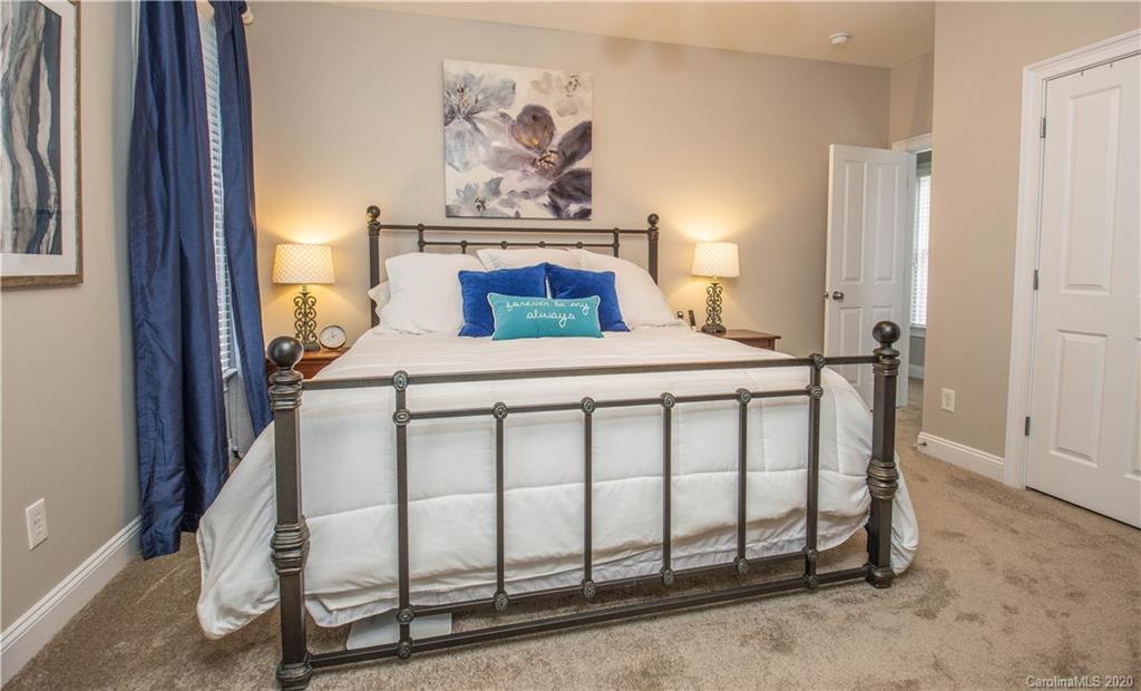 728 Shady Grove Crossing Fort Mill, SC 29708 - Photo 23 of 41 a bedroom with a bed table and window