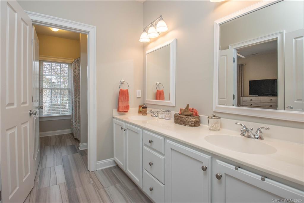 728 Shady Grove Crossing Fort Mill, SC 29708 - Photo 24 of 41 a bathroom with a double vanity sink and a mirror