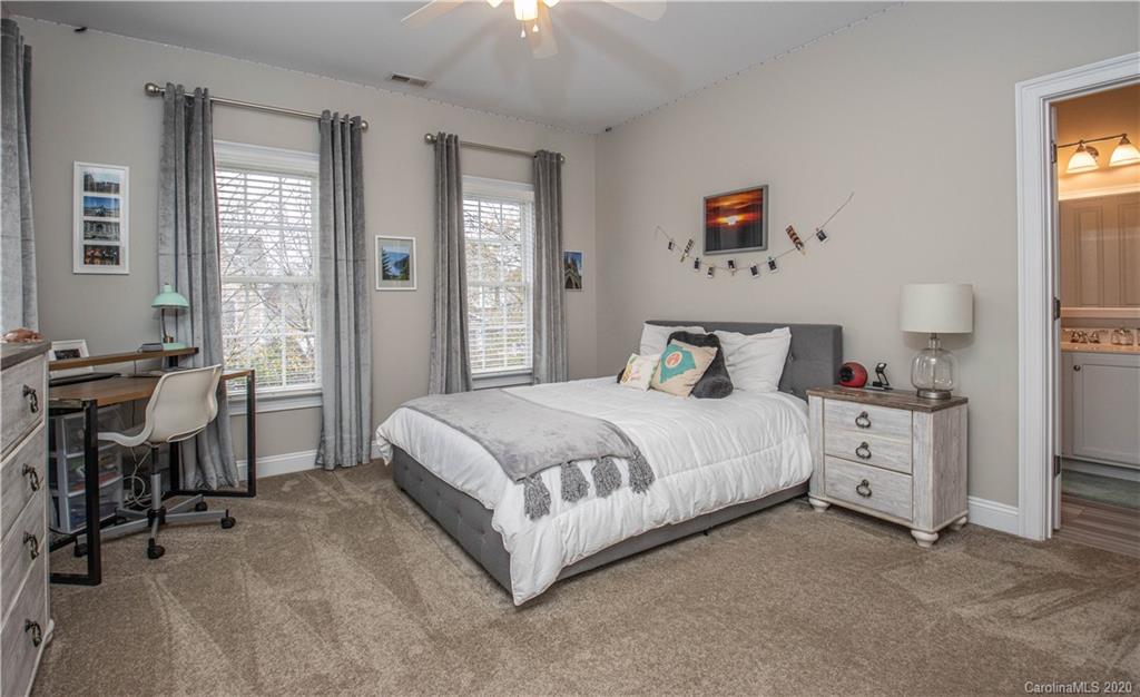 728 Shady Grove Crossing Fort Mill, SC 29708 - Photo 26 of 41 a bedroom with a bed and a window