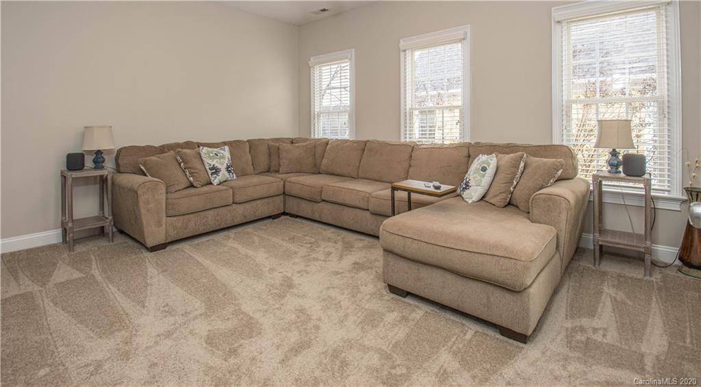 728 Shady Grove Crossing Fort Mill, SC 29708 - Photo 28 of 41 a living room with a couch and a large window