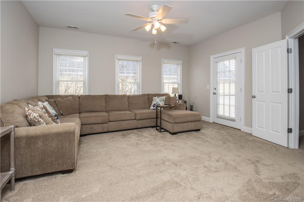 728 Shady Grove Crossing Fort Mill, SC 29708 - Photo 29 of 41 a living room with furniture and a window