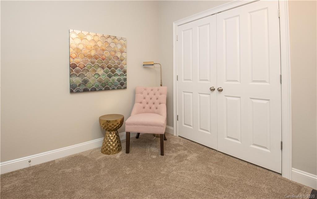 728 Shady Grove Crossing Fort Mill, SC 29708 - Photo 31 of 41 a view of a room with a window and a chair