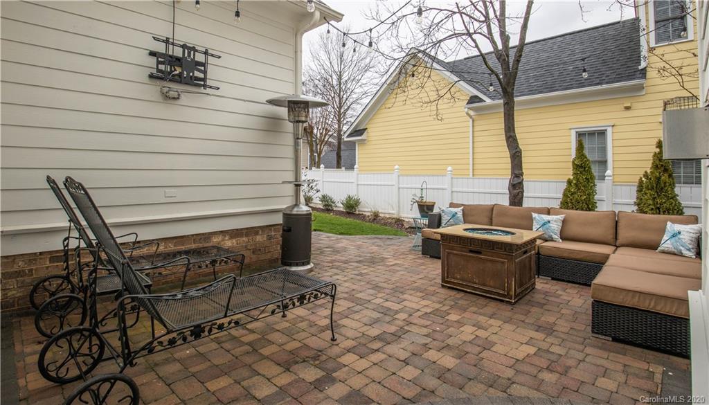 728 Shady Grove Crossing Fort Mill, SC 29708 - Photo 32 of 41 a view of patio with a table and chairs and a barbeque