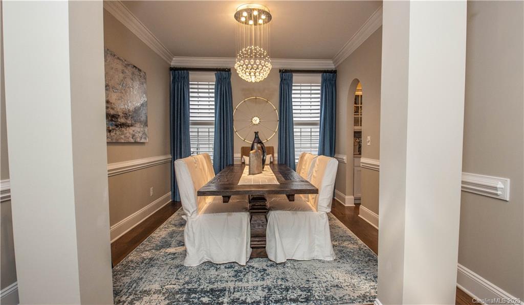 728 Shady Grove Crossing Fort Mill, SC 29708 - Photo 5 of 41 a view of a dining room with furniture window and wooden floor