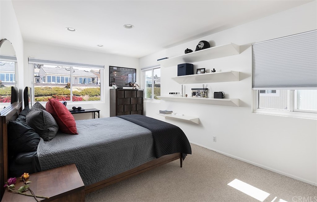 33525 Binnacle Drive Dana Point, CA 92629 - Photo 14 of 76 a bedroom with a bed and cabinets