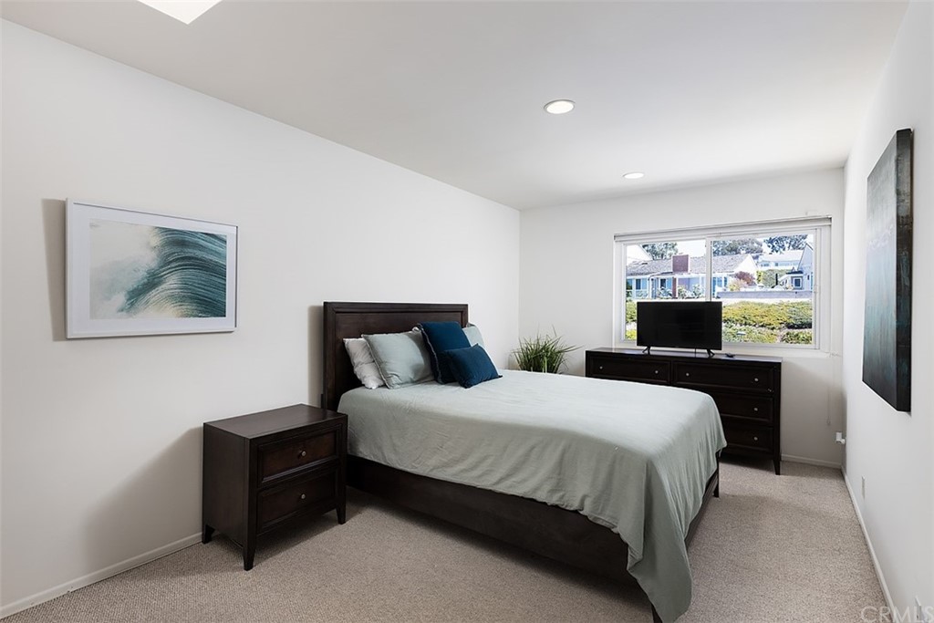 33525 Binnacle Drive Dana Point, CA 92629 - Photo 15 of 76 a bedroom with a bed and a tv