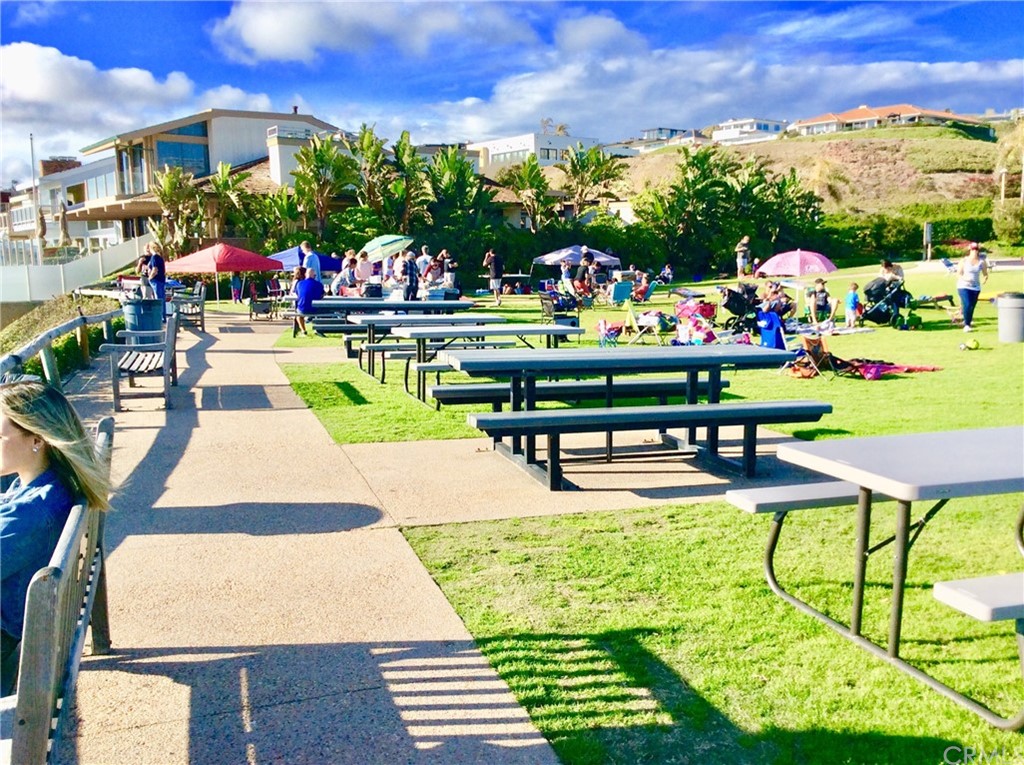 33525 Binnacle Drive Dana Point, CA 92629 - Photo 45 of 76 a view of swimming pool with outdoor seating and a garden