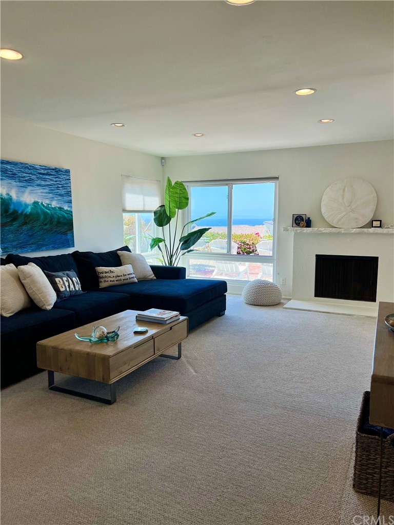 33525 Binnacle Drive Dana Point, CA 92629 - Photo 9 of 76 a living room with furniture and a flat screen tv