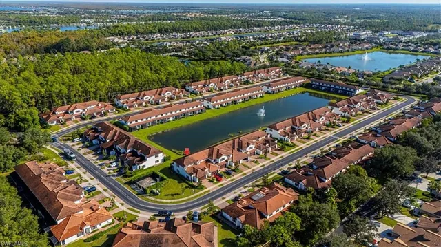 an aerial view of a resort with swimming pool and ocean view