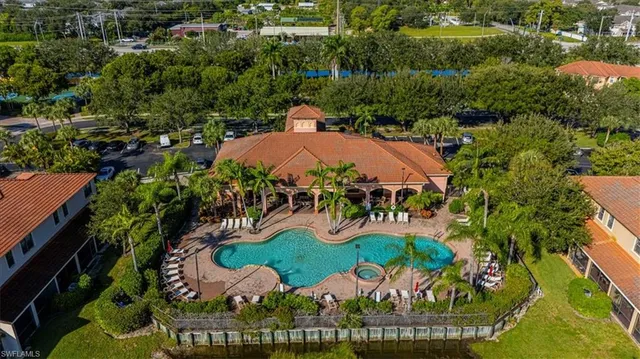 an aerial view of an outdoor space swimming pool patio and outdoor seating