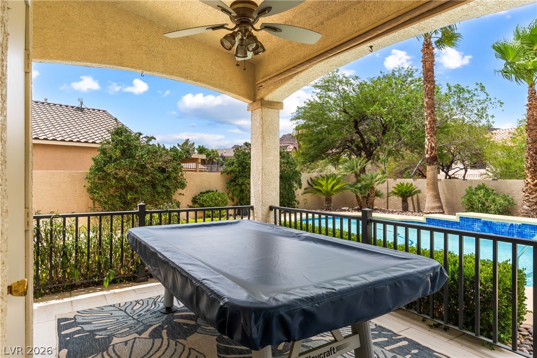 708 Vortex Avenue Henderson, NV 89002 - Photo 48 of 71 A well-appointed patio with a refreshing pool invites serene outdoor living.