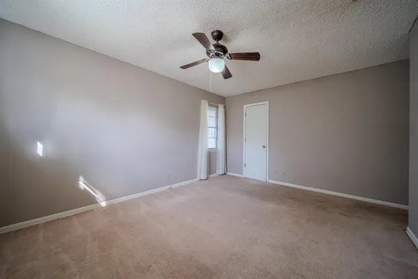 a view of a ceiling fan in a room