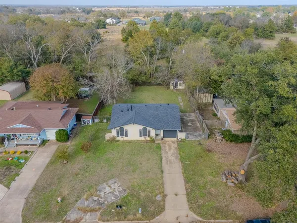 an aerial view of residential houses with outdoor space