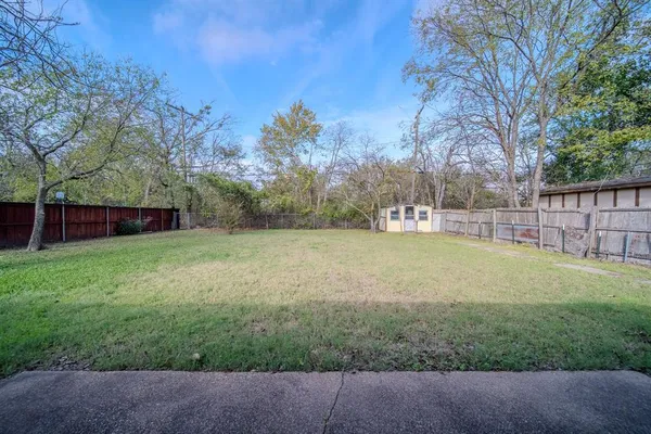 a view of a backyard with a garden