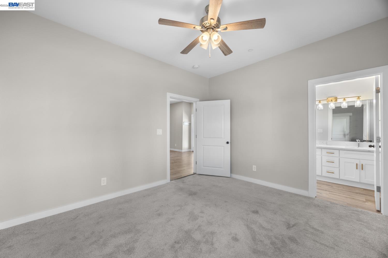 47 North 2nd Street Rio Vista, CA 94571 - Photo 10 of 21 an empty room with chandelier fan and windows