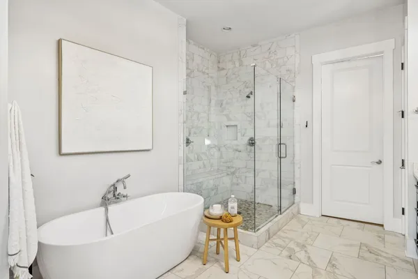 a bathroom with a bathtub and a shower