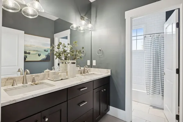 a bathroom with a bathtub and a shower