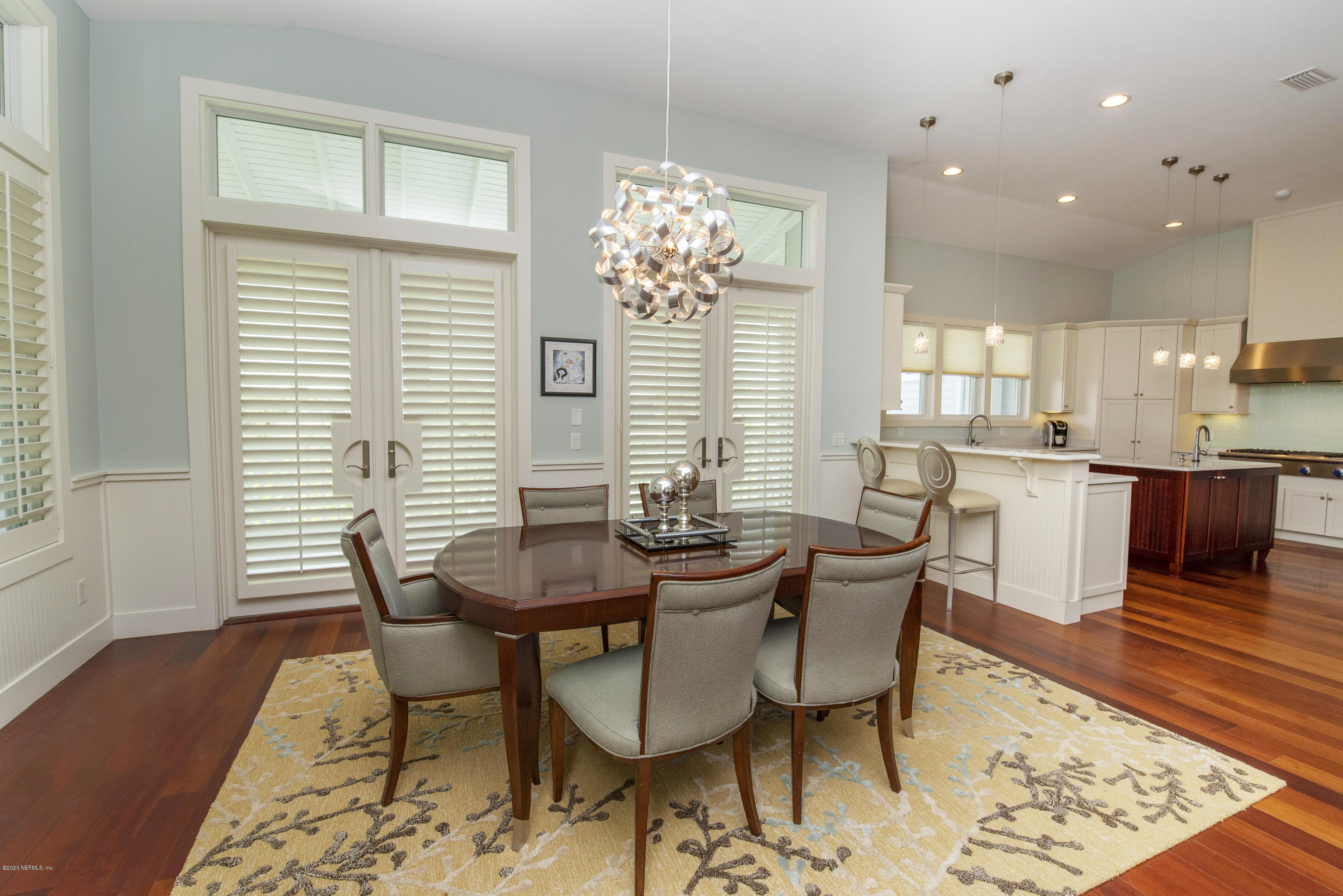 529 Barefoot Trace Circle St. Augustine, FL 32080 - Photo 19 of 62 a view of a dining room with furniture and wooden floor