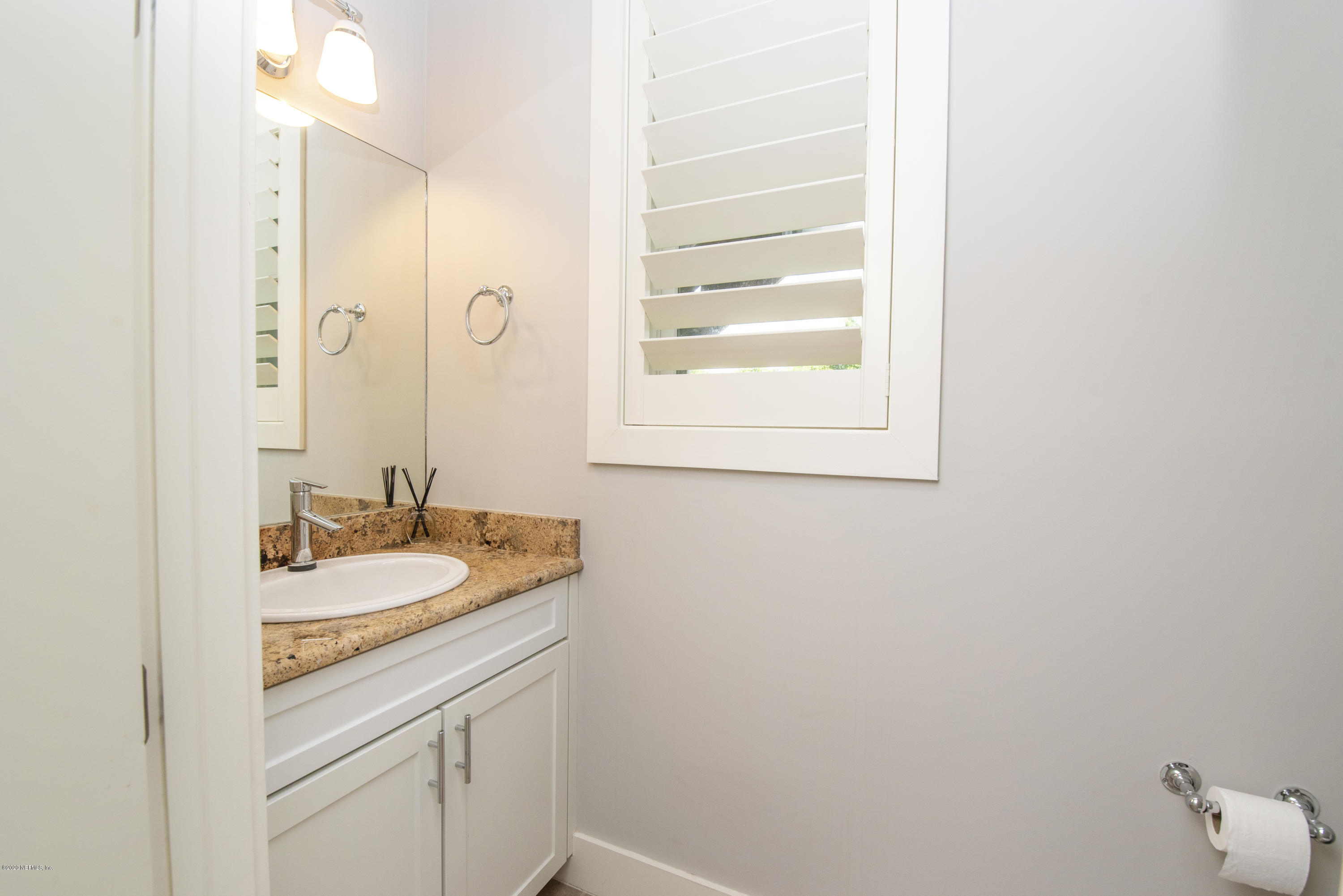 529 Barefoot Trace Circle St. Augustine, FL 32080 - Photo 24 of 62 a bathroom with a granite countertop sink and a mirror