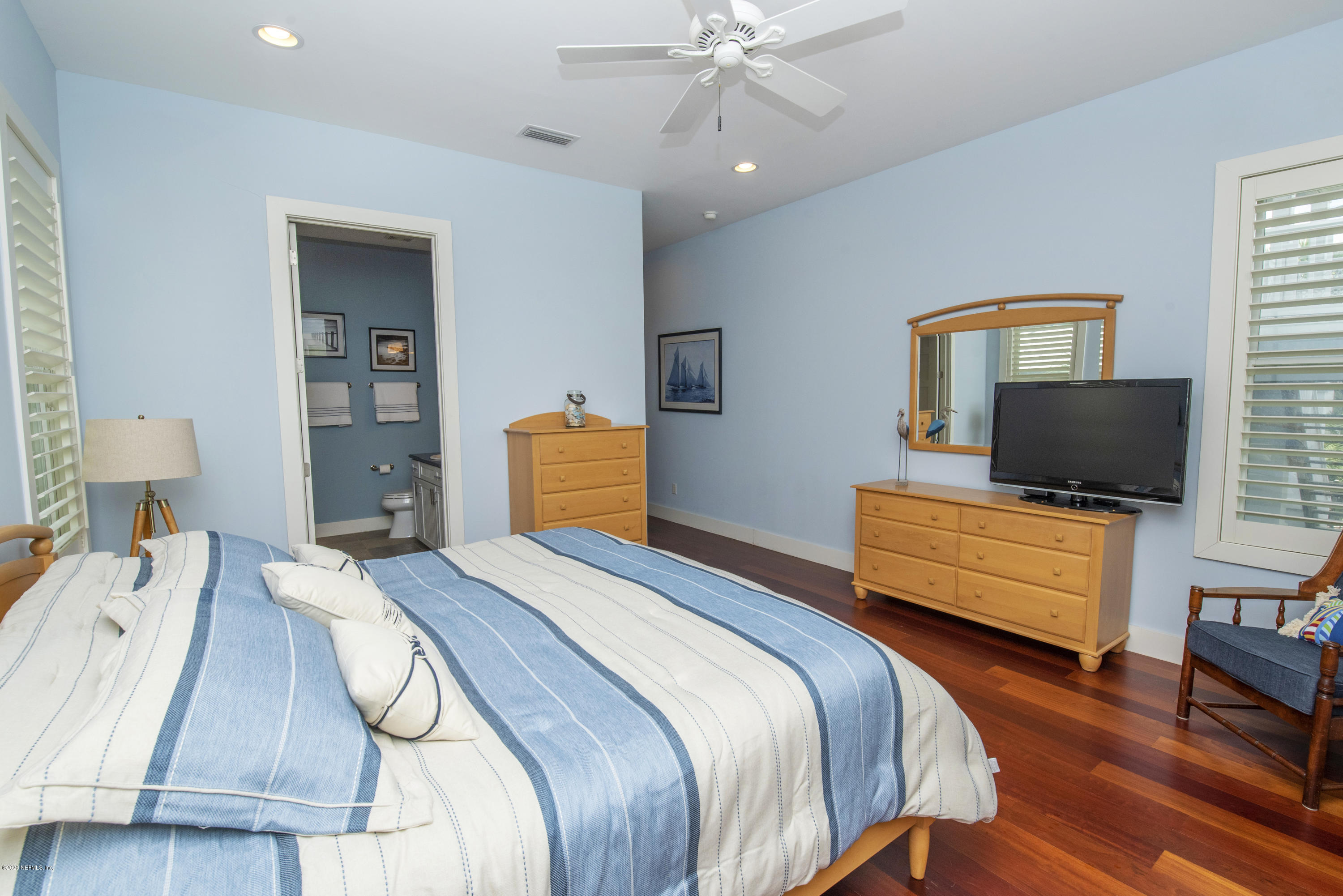 529 Barefoot Trace Circle St. Augustine, FL 32080 - Photo 32 of 62 a bedroom with a bed and flat screen tv