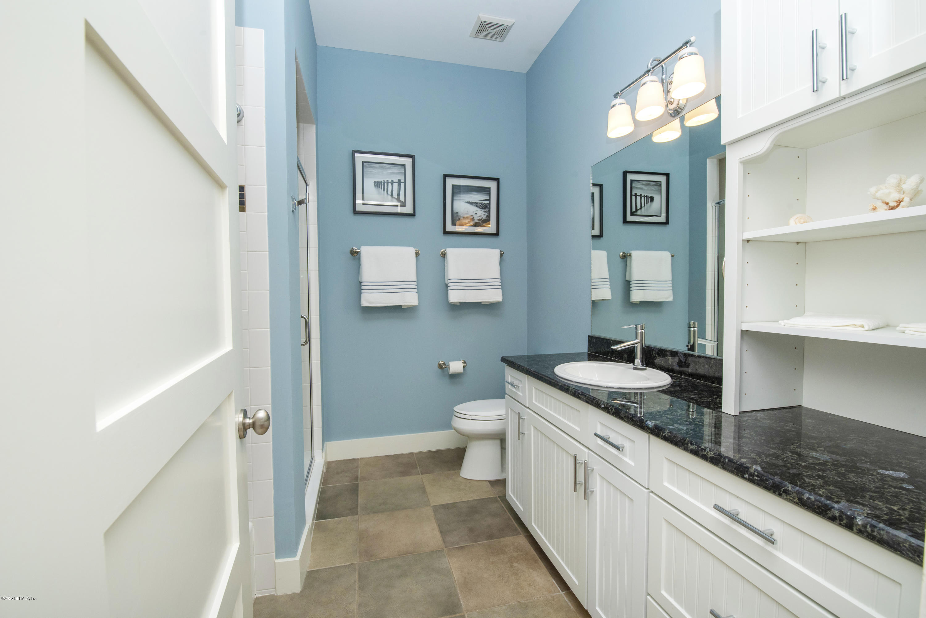 529 Barefoot Trace Circle St. Augustine, FL 32080 - Photo 33 of 62 a spacious bathroom with a granite countertop sink and a mirror