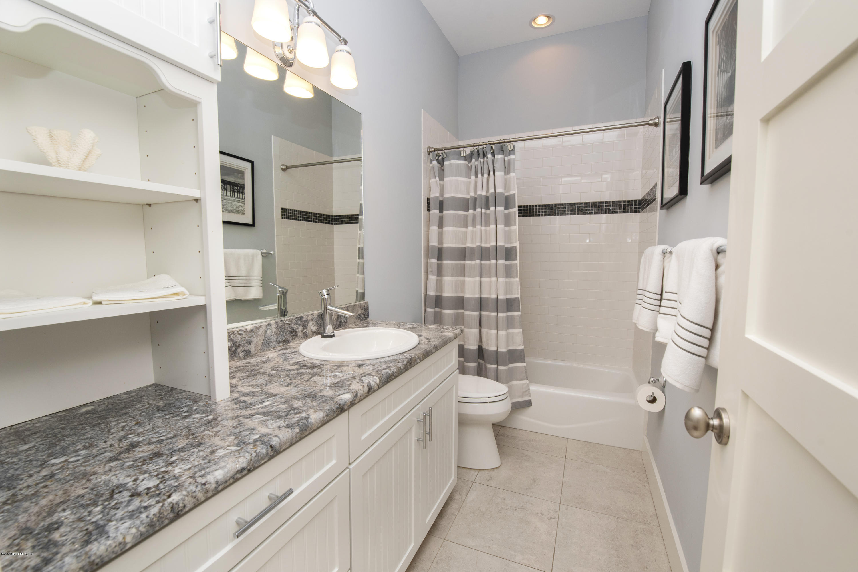 529 Barefoot Trace Circle St. Augustine, FL 32080 - Photo 42 of 62 a bathroom with a granite countertop sink toilet and shower