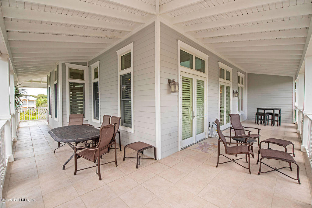 529 Barefoot Trace Circle St. Augustine, FL 32080 - Photo 48 of 62 a living room with furniture and a large window