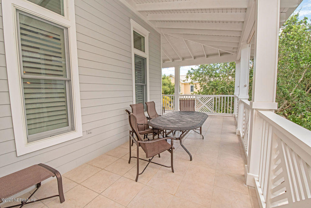 529 Barefoot Trace Circle St. Augustine, FL 32080 - Photo 49 of 62 a view of a patio with a table and chairs