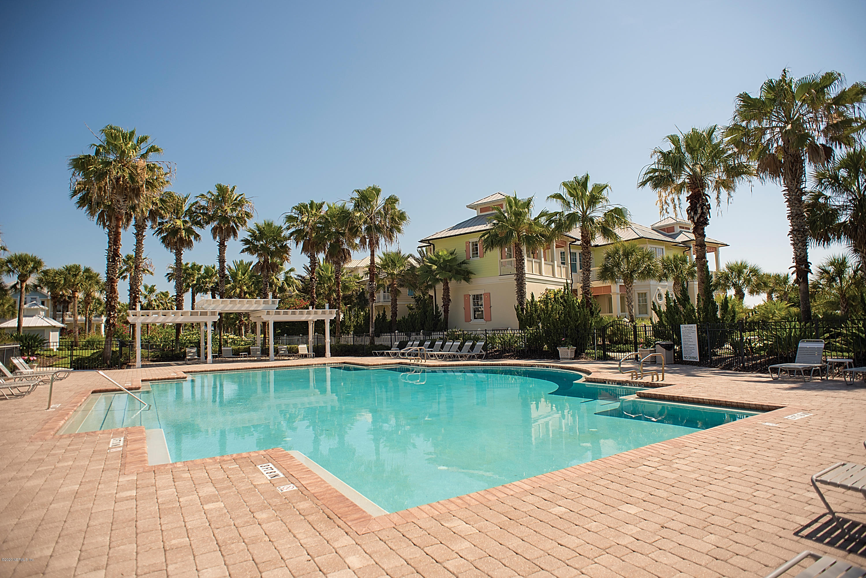 529 Barefoot Trace Circle St. Augustine, FL 32080 - Photo 55 of 62 a view of a lake with a house swimming pool and lake view