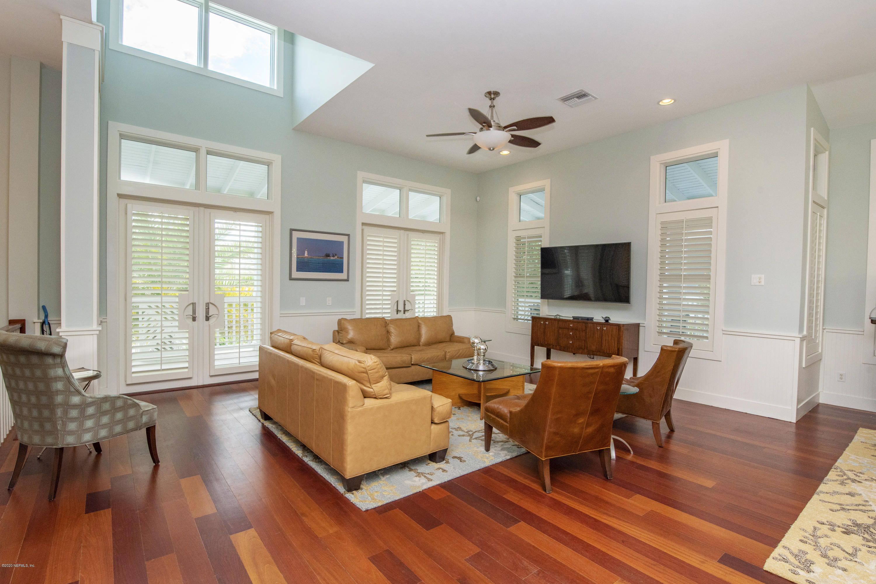 529 Barefoot Trace Circle St. Augustine, FL 32080 - Photo 8 of 62 a living room with furniture and a flat screen tv