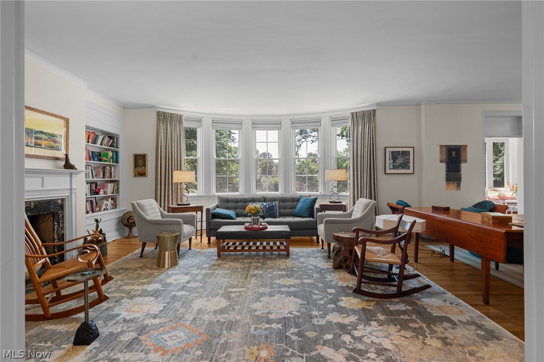 12546 Cedar Road, Unit 4 Cleveland Heights, OH 44106 - Photo 10 of 43 Spacious living room with
hardwood floors, bay window, decorative fireplace flanked with custom built-ins