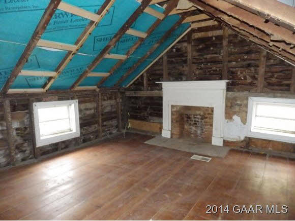 27 Mish Barn Road Middlebrook, VA 24459 - Photo 9 of 13 a view of an empty room with a fireplace and a window