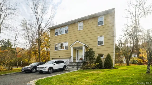 a view of a car parked in front of a house