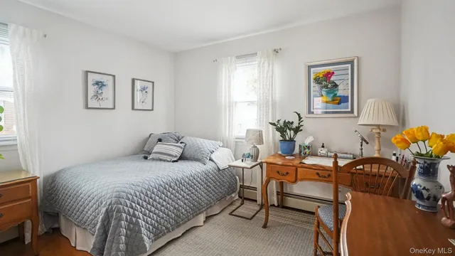 a bedroom with a bed and a table in it