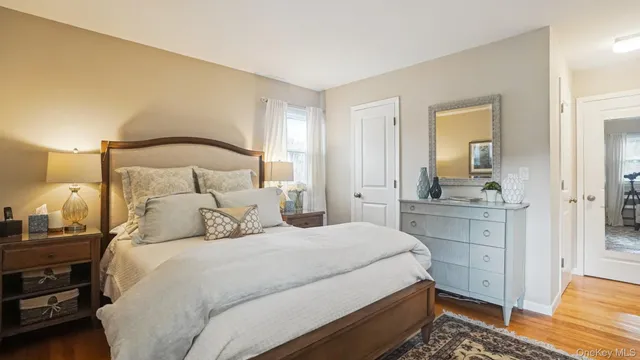 a bedroom with a bed and a dresser in it