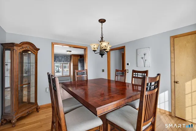 a dining room with furniture and window