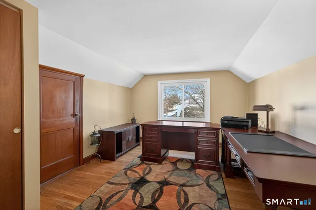 a view of a workspace with furniture