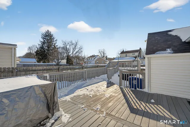 a view of a balcony with wooden floor