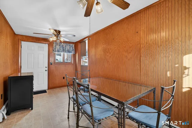 a view of a room with furniture and window