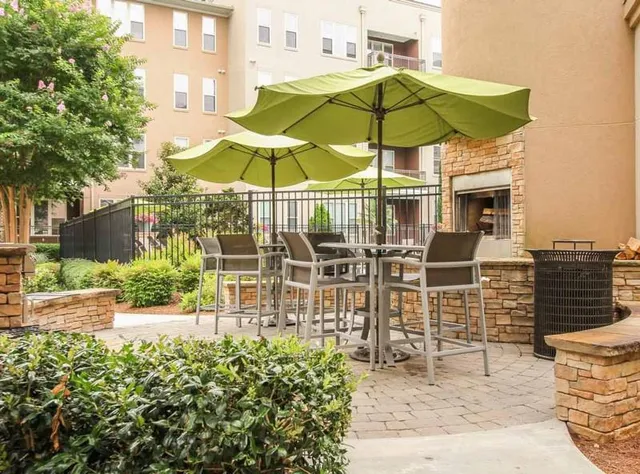 a view of a swimming pool with outdoor seating