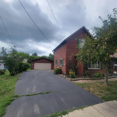 a view of a house with a yard