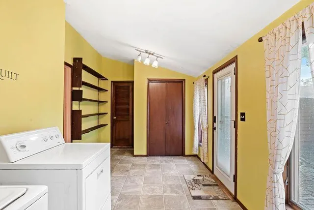 a view of hallway with washer and dryer