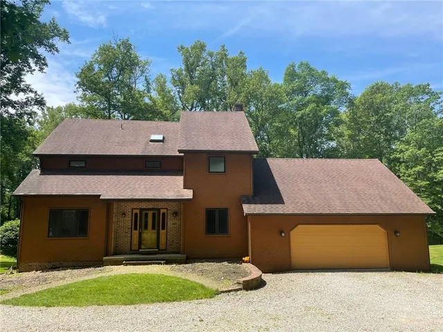 front view of a house with a yard