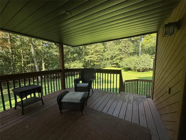 a balcony with furniture and outside view